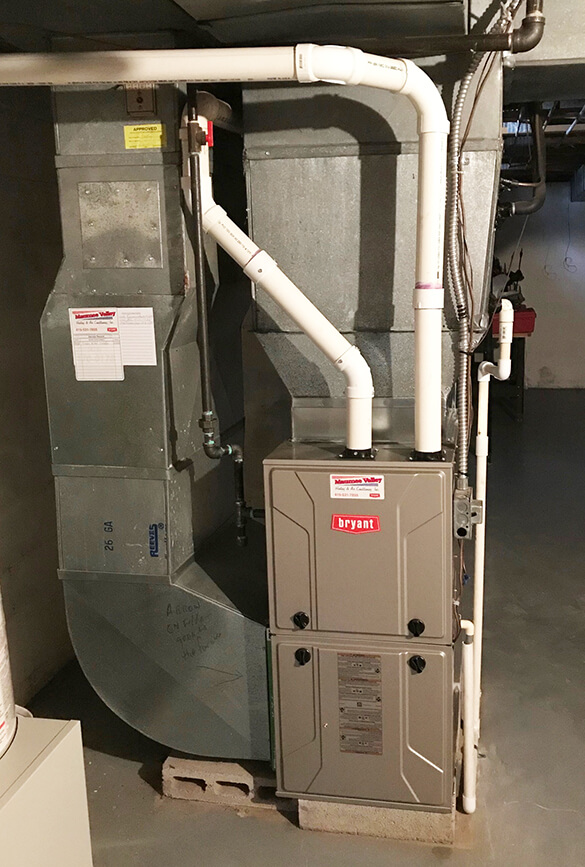Gas furnace installation in basement for upflow of heat installated Maumee Valley Heating in Toledo